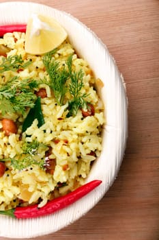 Indian rice breakfast - yellow rice garnished with coriander