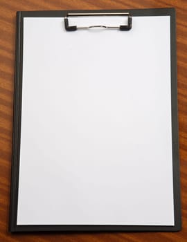 photo of a Clipboard a over wood background