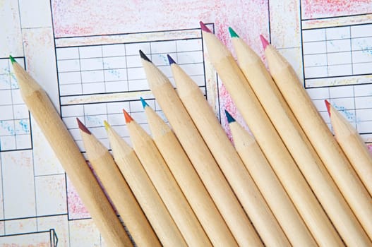 a photo of pencils of colors on a drawing