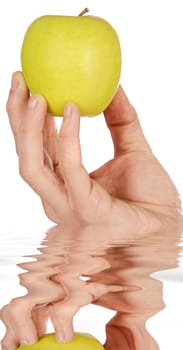 Apple in a hand low in calories a over white background