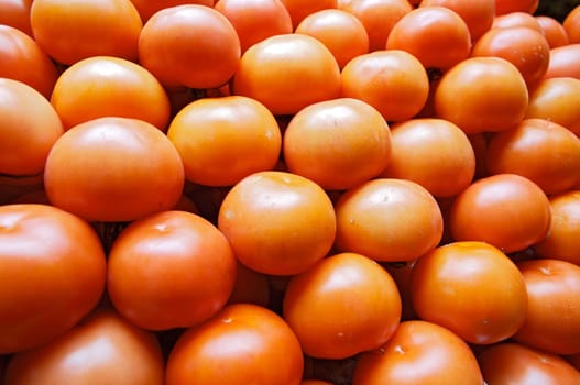 piling up of tomatoes in a store of fruits