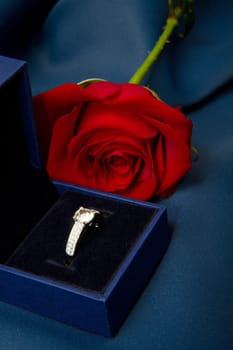 a red rose with ring's gift