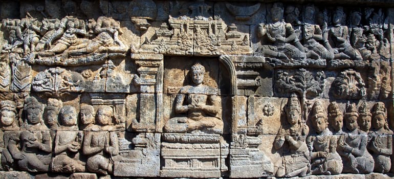 Ancient stone carvings Borobudur temple located close to Yogyakarta in Java Indonesia
