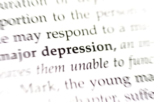 The word depression with surrounded by blurred and faded words