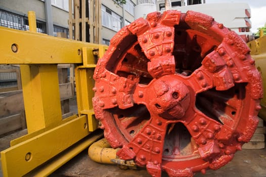 Close-up of a red drill head on a construction site in downtown Berlin in daylight