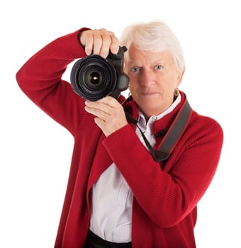 A senior woman is photographing you.