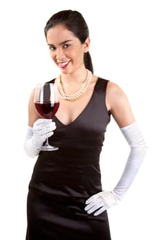 A beautiful smiling woman in a classy dress is holding a glass of red wine.
