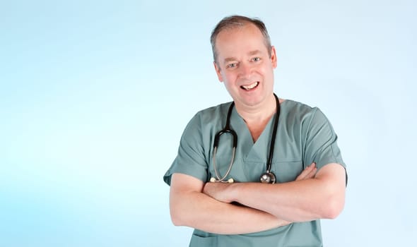 A physician is smiling at the camera.