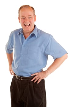 A standing man is smiling at the camera.
