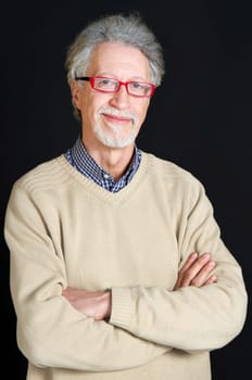 Portrait of a happy mature man isolated on black background