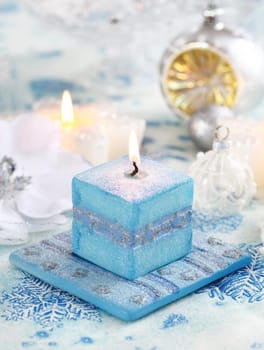 Christmas still life with candles and white and blue tone
