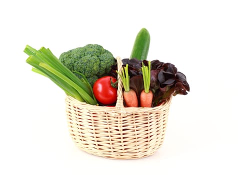 Various vegetables and fruits in the basket on white background