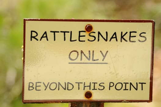 Sign for Rattlesnakes only beyond this point