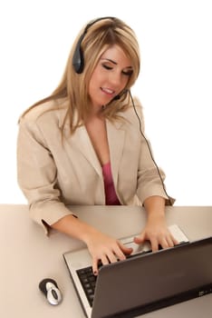 Beautiful and sexy blond business woman with laptop