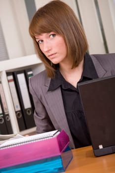 young woman by office work with laptop