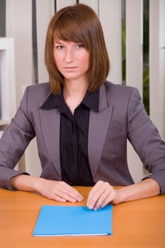 woman with application file in office