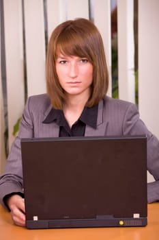 portrait of female secretary by office work