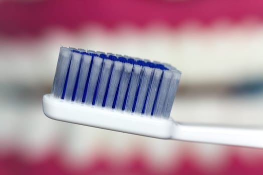Brushing your teeth with a toothbrush