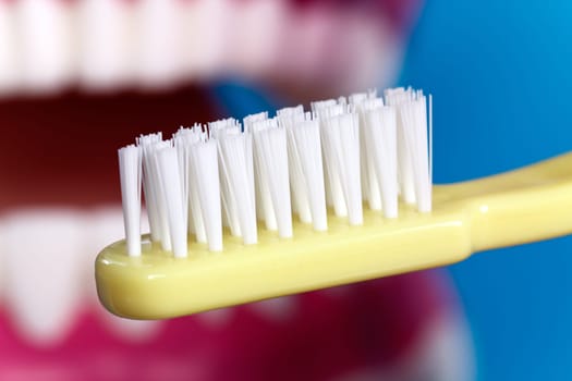 Brushing your teeth with a toothbrush