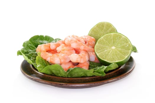 fresh prawns and lime against white background