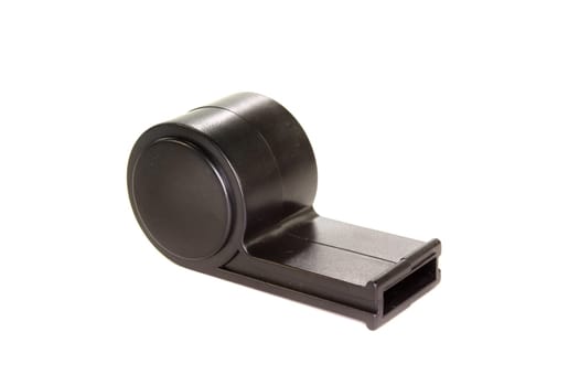 a black whistle against a white background