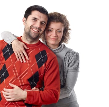 Young happy couple posing and hugging