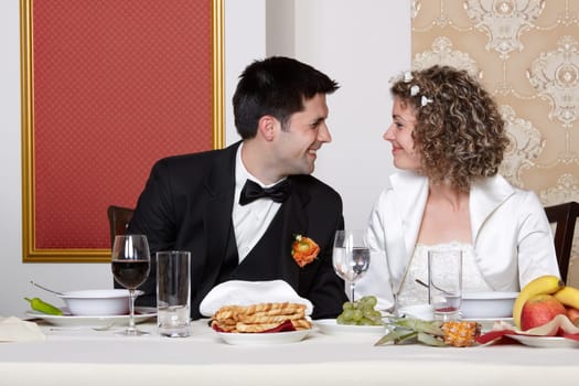 Cute bride and groom looking happily each other