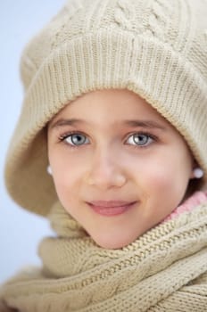 precious face of an adorable girl a over blue background