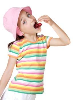 Cute girl eating fresh cherries isolated on white