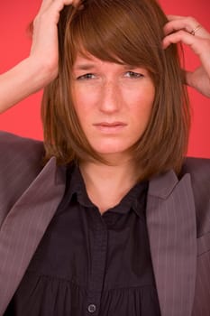 portrait of sad businesswoman over red background
