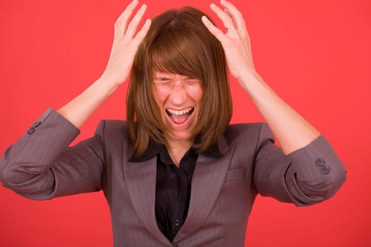 angry woman screaming out loud over red background