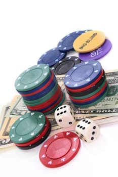 Colorful chips and dollar bills against white background