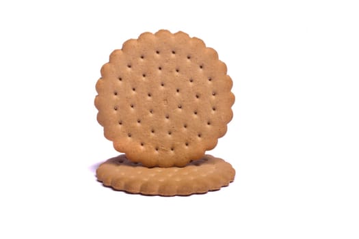 View of two round biscuits isolated on a white background.