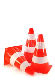 three pylons against a white background