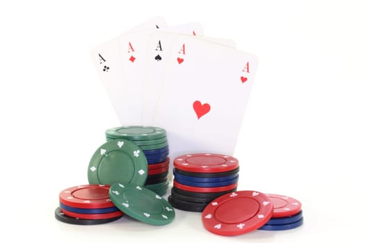 colorful chips and playing cards against white background
