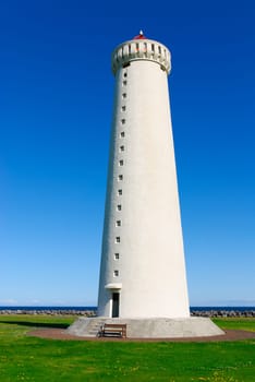 Poroddsstadir lighthouse in the background of blue sky