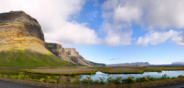 Mountain and lake on the road between Vik and Jokulsarlon