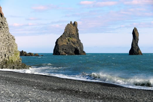 Faraglioni of organ pipes on the beach at Vik in Southern Iceland