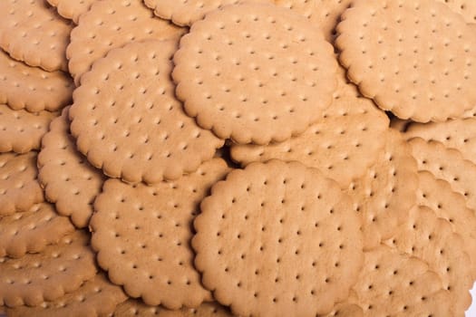 View of many round biscuits stacked on top of each other.