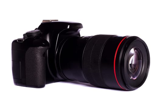 Close view of a modern photographic DSLR camera isolated on a white background.