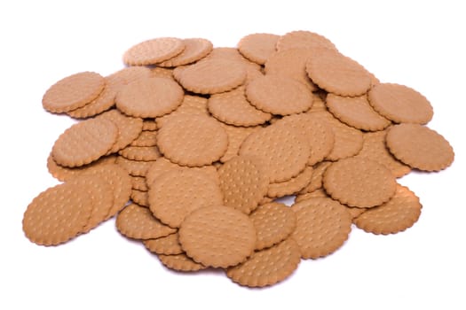 View of many round biscuits isolated on a white background.