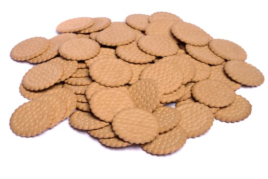 View of many round biscuits isolated on a white background.