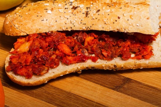 View of a dish of fresh sandwich with seeds filled with Portuguese chorizo.