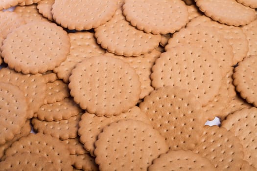 View of many round biscuits stacked on top of each other.