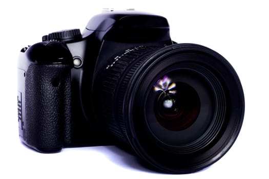 Close view of a modern photographic DSLR camera isolated on a white background.