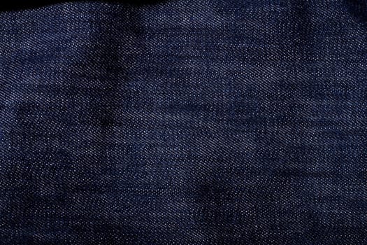 Close up view detail of the fabric of some jeans.