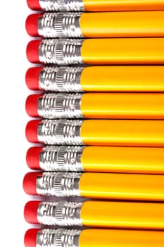 Close up view of a bunch of yellow pencils isolated on a white background.