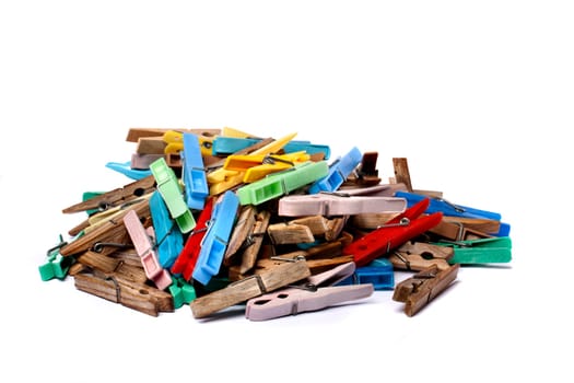 Close up view of some colorful cloth pegs isolated on a white background.