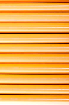 Close up view of a bunch of yellow pencils isolated on a white background.