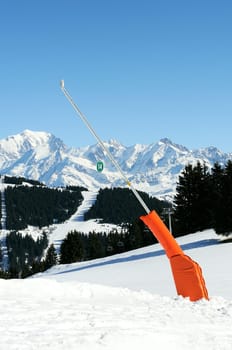 Snow cannon and ski lifting line